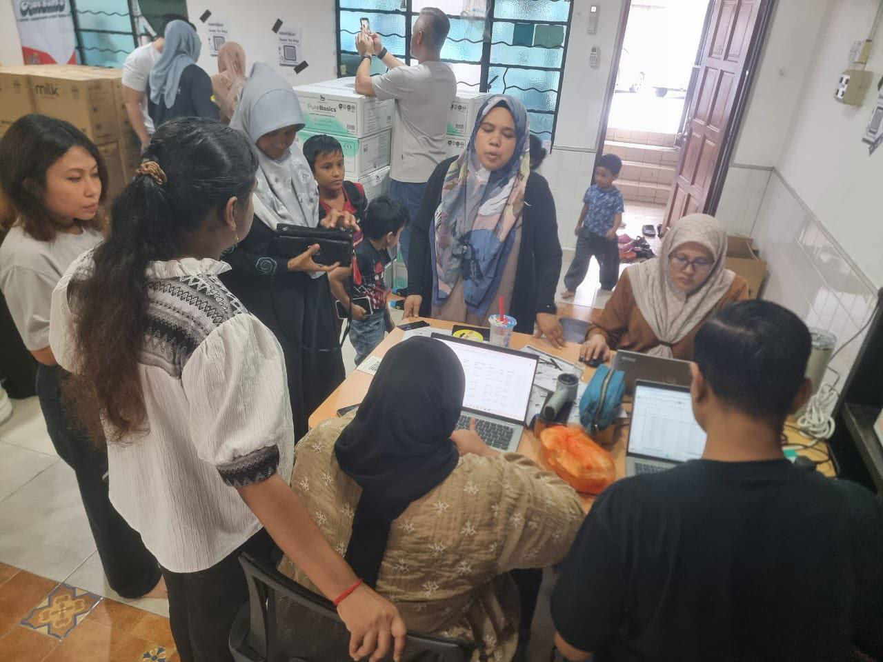 HealthHub staff helping residents at a community health event