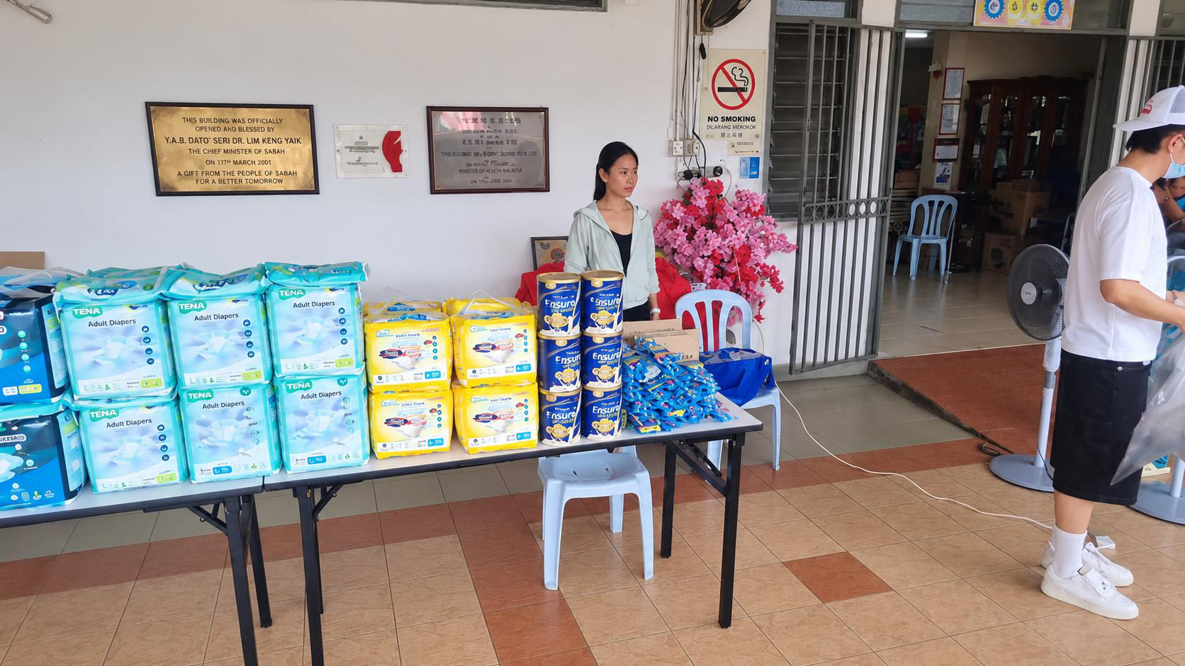 Donated health products laid out on a table at a community centre